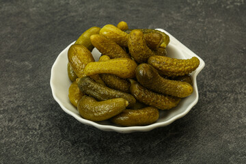 Pickled gherkin in the bowl