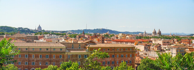 Fototapeta premium Panorama of Rome. View from the Aventine Hill. Dome of St. Peter on the horizon