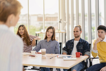 Riew view of Manager woman talking in serious to group Of Asian and Multiethnic Business member team with casual suit in earnest action when project is delay in the modern workplace, diversity concept