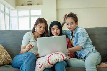 Urban lifestyle concept, 3 asian lady at the sofa using laptop
