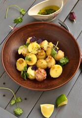 Simple salad with young potatoes with mustard-lime sauce, vertical