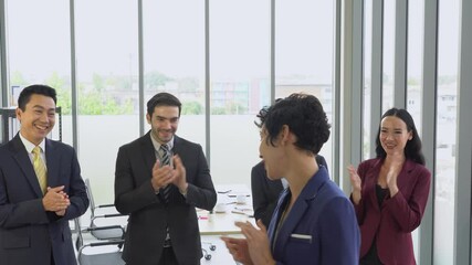 young caucasian employee get promotion and multiracial colleagues appreciate with her in meeting room in corporate. concept of diversity