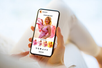 Woman editing photo on mobile phone for posting it on social media