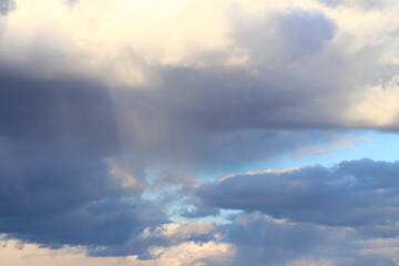 Fototapeta na wymiar Rain gray clouds in the blue sky during the day. 