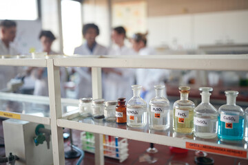 Young chemistry students preparing for a work in the university laboratory. Science, chemistry, lab, people