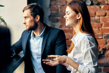 man and woman sitting in cafe communication officials lifestyle