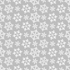 Winter seamless pattern with white snowflakes on grey background. Vector illustration for fabric, textile wallpaper, posters, gift wrapping paper. Christmas vector illustration. Falling snow