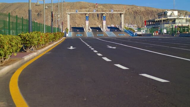 TENERIFE, CANARY ISLANDS, SPAIN - April 2021. Tourist area Los Cristianos. Ferry crossing in a Pandemic. Lockdown in Spain. Travel in EU. Sea terminal without people.