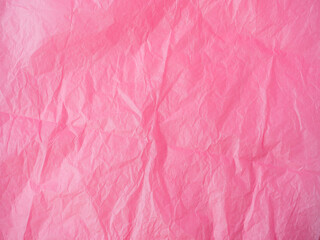 Fototapeta premium The texture of crumpled paper is maroon. top view, copy space. color background