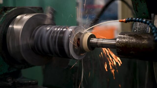 Grinding on the machine with the butt end of the abrasive wheel. Sparks on a grinding machine.