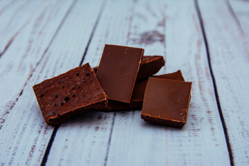 chocolate pieces on wooden background, chocolate, sweet, food, dessert, brown, dark, isolated, candy, bar, white, cocoa, milk, delicious, snack, broken