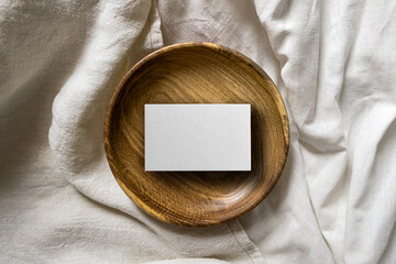 Business Card Mockup on Wooden Platter. Top view image