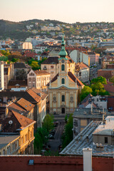 Hungary, Budapest spring cityscape, church against the background of modern architecture