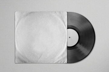 Vinyl record mockup in a crumpled old paper package on a textured background