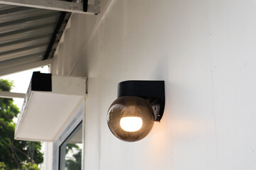 Beautiful lamp on white wall.