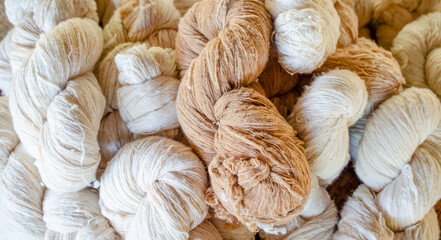 White and brown natural cotton thread bundle ready for fabric or garment production