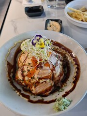 Aburi Salmon Don rice bowl at japanese restaraunt, fatty salmon garnished with mayonnaise and seaweed 