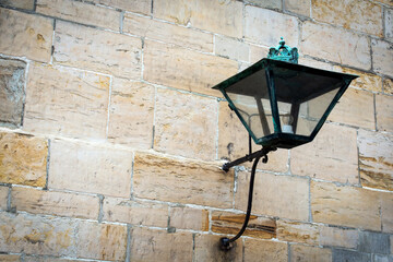 Old street lamp, on a stone wall. Close-up. Kronborg Castle. Helsingor.