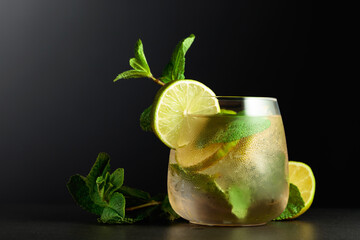 Frozen glass with a Mojito on a black background.