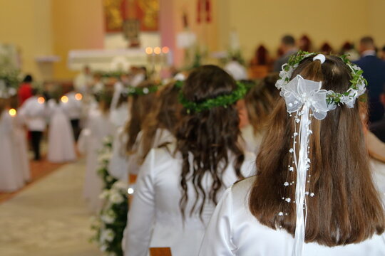 Children and church interior during Fist Holy Communion ceremony