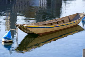 Wooden boat on river Limmat in the morning at springtime. Photo taken April 23rd, 2021, Zurich, Switzerland.