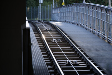 Tracks of cable car station at City of Zurich early in the morning at springtime. with sunbeams and backlight. Photo taken April 23rd, 2021, Zurich, Switzerland.
