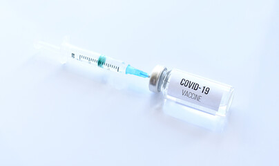 Vaccine against coronavirus and a syringe with a vaccine. Isolate