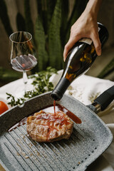 hand holding a slice of pizza