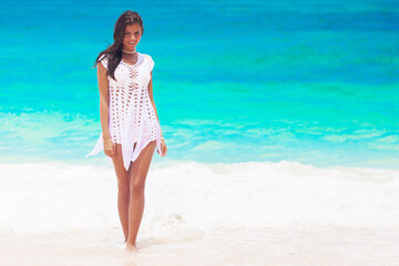 Happy woman walking on beach © yellowj