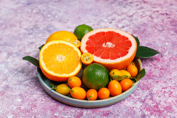 Fototapeta na wymiar Assorted fresh citrus fruits,lemon,orange,lime,grapefruit,kumquats.