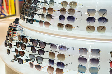 Sunglasses in the shop display shelves.