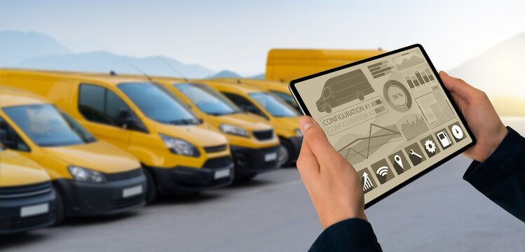 Manager With A Digital Tablet On The Background Of Vans. Fleet Management	