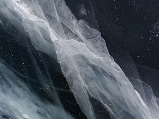 the cracked ice of Lake Baikal is a unique natural pattern. Winter in Siberia Russia