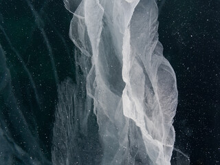 cracks in the ice of Lake Baikal. Natural patterns that never repeat. Winter in Siberia Russia