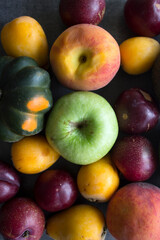 Fresh seasonal fruits and vegetables close up photo. Vibrant colors of raw ingredients. Healthy eating concept. 