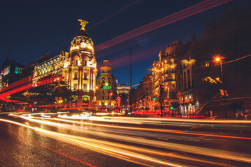 Fototapeta na wymiar Madrid, Spain, May 29 2017: Gran Via one of the most famous streets in Madrid illuminated at night with car lights