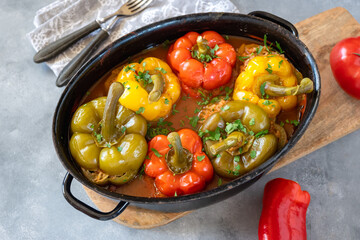 Pepper stuffed with minced meat and rice in tomato sauce.