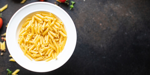 pasta penne durum wheat trend meal snack copy space food background rustic. top view