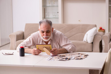 Old sick man suffering at home