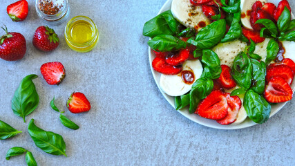 Caprese salad with strawberries. Healthy summer salad. Strawberry caprese. Diet food. Keto salad.