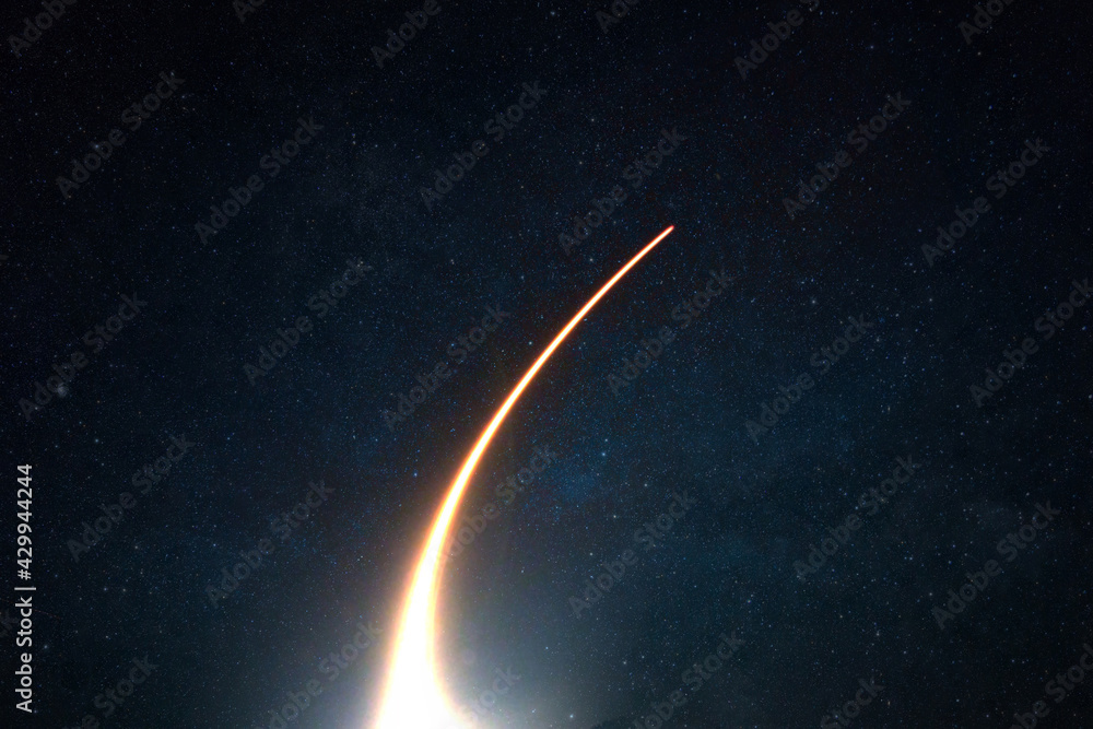 Poster rocket with a light blast flies and takes off into space in the starry sky. spaceship launch on a da