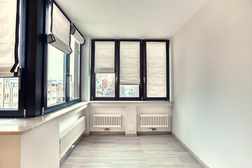 Empty white room interior with roman vertical curtains and parquet floor
