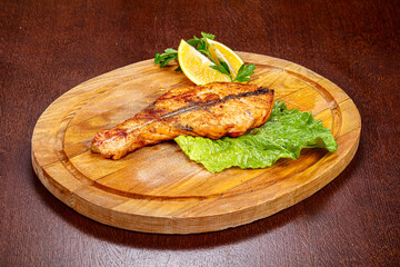 Roasted salmon steak served lemon