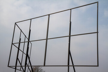 Empty billboard structure against the sky