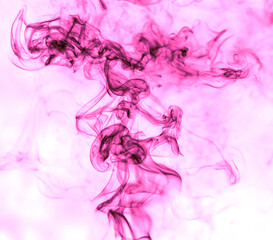 Obraz na płótnie Canvas Pink smoke on a white background.