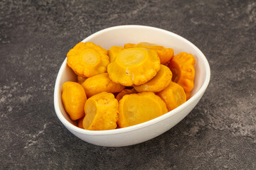 Marinated yellow patisson in the bowl