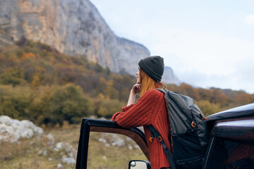 woman hiker near car in mountains travel adventure trip
