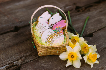 Fototapeta na wymiar easter , eggs and flowers , cookies , spring , food , jonquil , May , April