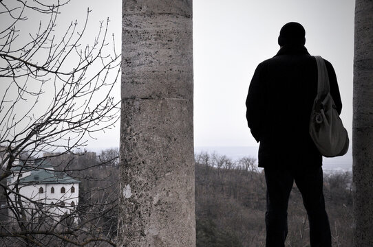 Man Looking At The City From The Observation Deck Waiting For The Fog To Clear