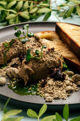 Toasts and chicken liver pate with halva and prunes 